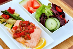 Salmon meal - grilled salmon served with fresh tomato salsa & grilled veg, mixed green salad, side of mixed fruits